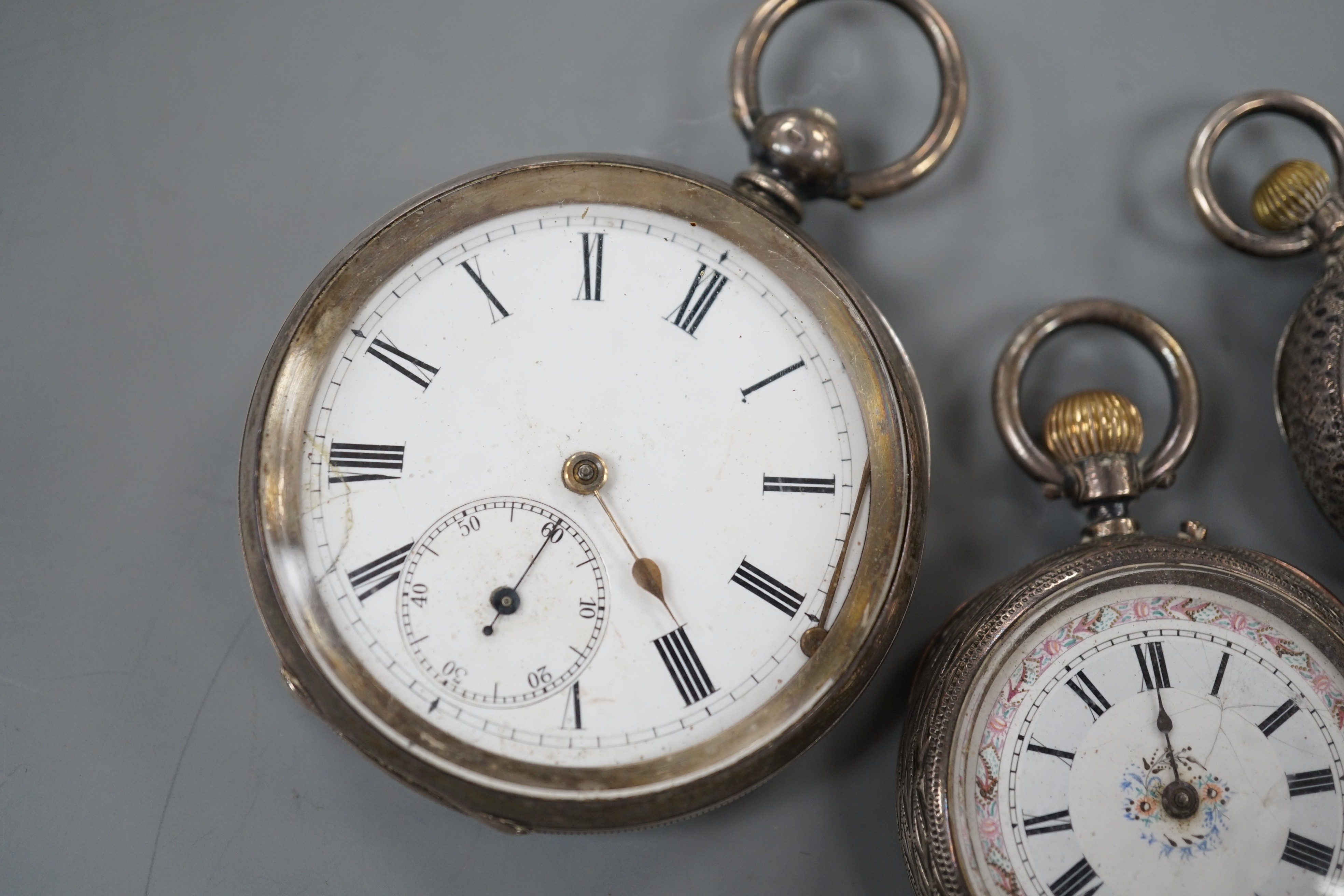A Swiss 935 white metal open faced pocket watch and two fob watches=, silver a 935 white metal.